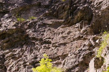 rock with ropes and carabiners