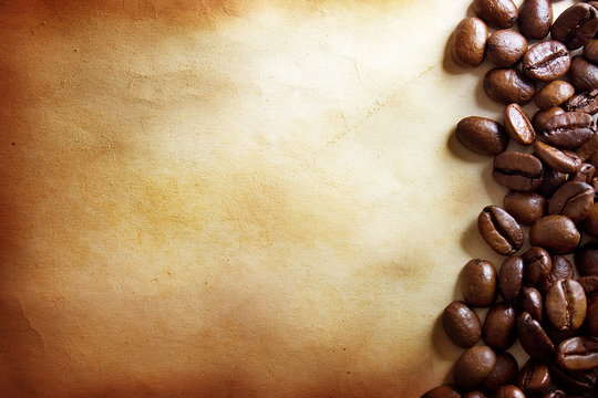 coffee beans on vintage paper background © Alexstar