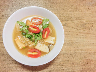Soup in a white bowl on the table