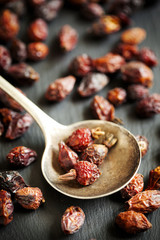 Dried rose hips berries on a dark background