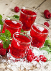 Cold Raspberry drink with mint and ice, selective focus