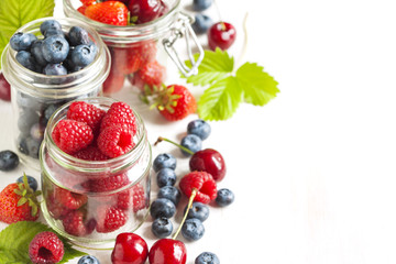 Summer berries in glass jar
