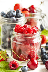 Summer berries in glass jar