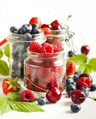 Summer berries in glass jar