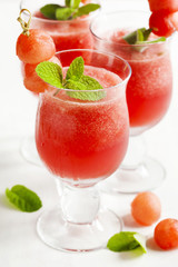 Watermelon smoothies in glass cup.