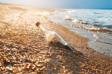 Sealed bottle near sea