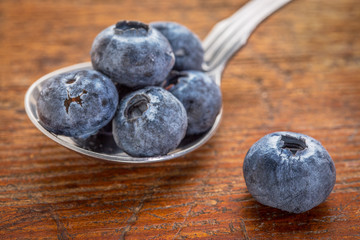 blueberries on tablespoon