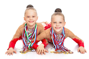 Girls gymnasts show medals