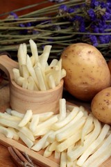French fries and fresh potatoes sliced