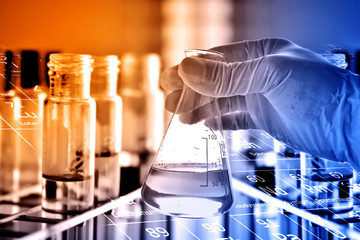 flask in scientist hand, laboratory concept 