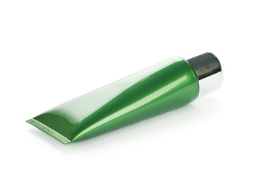 Green tube  with cream on white background