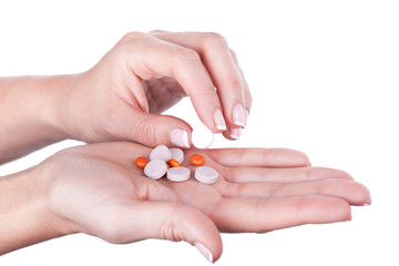 Taking one pill from pile