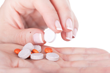 Obraz na płótnie Canvas Choosing one pill from pile