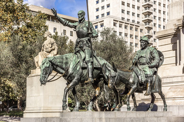 Monument of Miguel Cervantes on Plaza de Espana in Madrid, Spain - obrazy, fototapety, plakaty