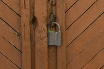  wooden door with a metal lock