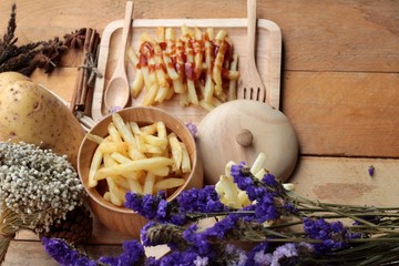 French fries and fresh sliced potatoes with ketchup.