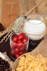 corn flake and milk with fresh cherry tomatoes.