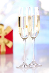Pair glasses of champagne and present box