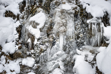 Fototapeta na wymiar Waterfall with snow Bavaria