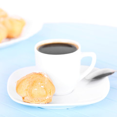 Cup of coffee on blue mat