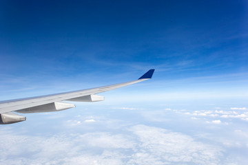 Fototapeta na wymiar Wing of airplane in the sky