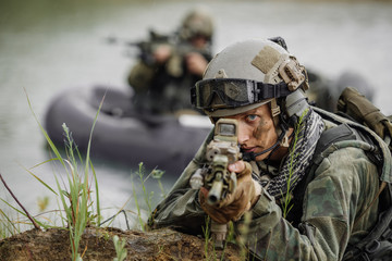 Portrait of a ranger in the battlefield with a gun