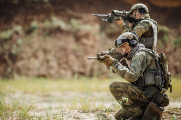 Portrait of a ranger in the battlefield with a gun