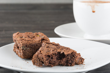 brownies in plate on wood table