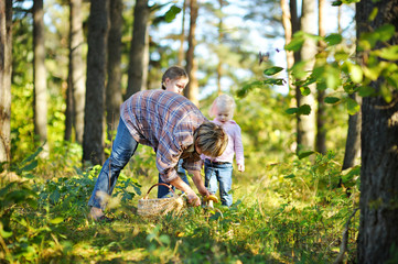 Grandmother and her girls picking mushrooms