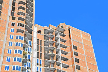 Building construction site work against blue sky