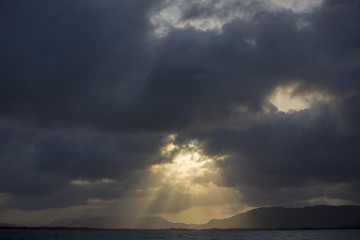 Sunrise over sea with dark dramatic clouds. Venezuela
