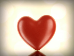 Red heart on light background