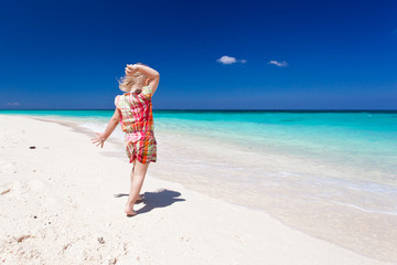 Happy little girl on the beach