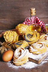 Still life of preparing pasta on rustic wooden background