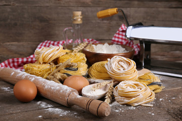 Still life of preparing pasta on rustic wooden background
