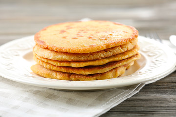 Tasty fritters on plate on table close up