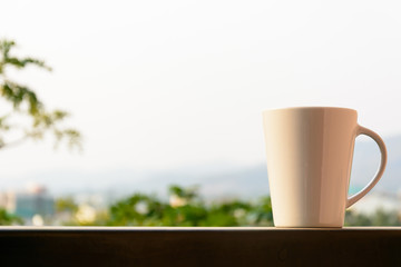 Morning cup of coffee on balcony