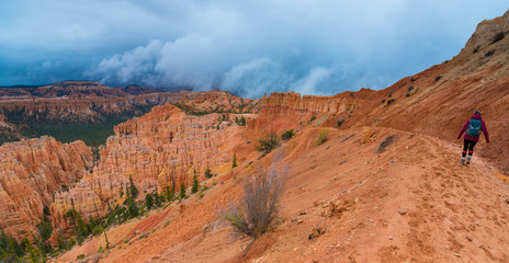 Girl Hiker on Peek-a-boo loop trail Bryce Canyon
