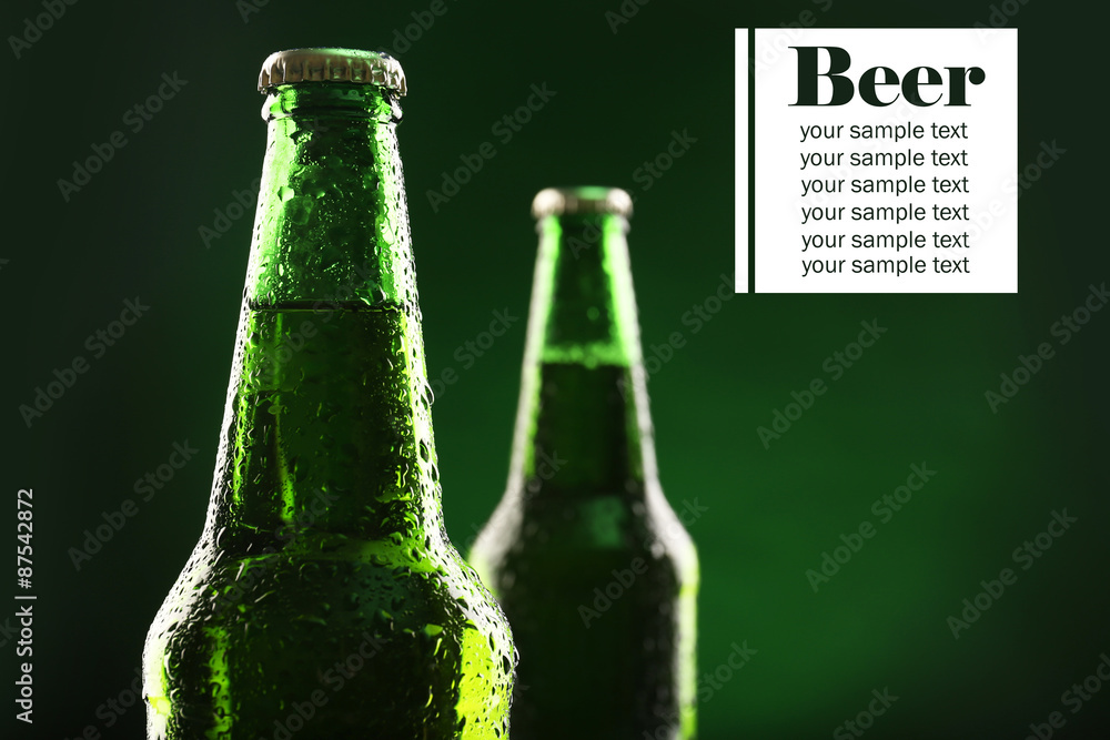 Sticker Bottles of beer on dark green background