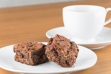 brownies in plate on wood table