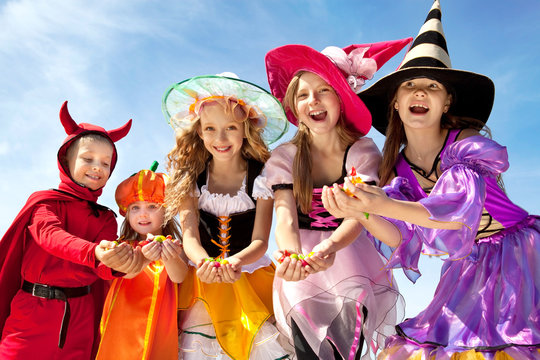 Five Halloween Children Holding Candies