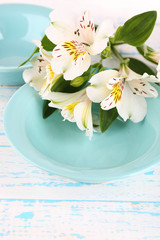 Table setting with flowers, closeup