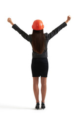 woman raising her hands up