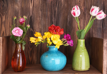 Fresh spring flowers on wooden background