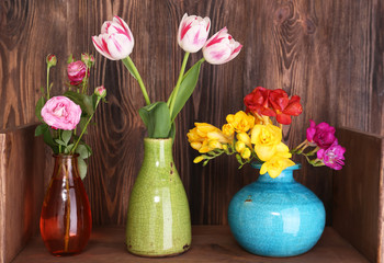 Fresh spring flowers on wooden background