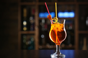 Glass of cocktails on bar background