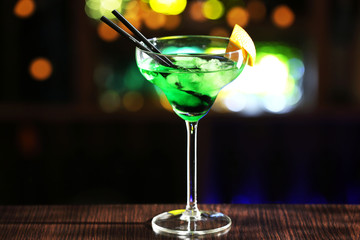 Glass of cocktails on bar background