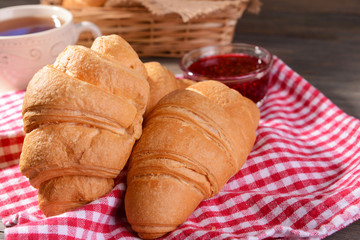 Delicious croissants on table close-up