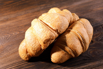 Delicious croissants on table close-up