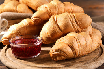Delicious croissants on table close-up